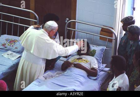 Pope John Paul II blesses the dying in St Joseph s Hospice Port Moresby in Papua New Guinea Stock Photo