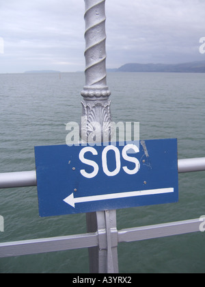 sos notice on pier, bangor, wales Stock Photo