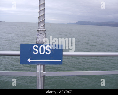 sos notice on pier, bangor, wales Stock Photo