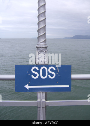 sos notice on pier, bangor, wales Stock Photo