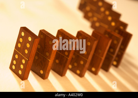 ROW OF SEVERAL ANTIQUE WOOD AND BRASS DOMINOES Stock Photo