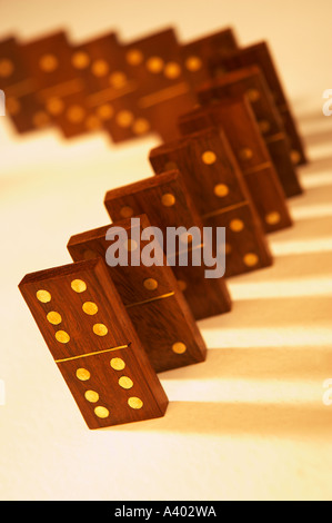 ROW OF SEVERAL ANTIQUE WOOD AND BRASS DOMINOES Stock Photo