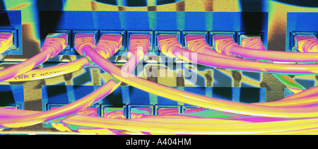 Posterised photo of cables connected to networking hubs in a rack system on a computer Stock Photo