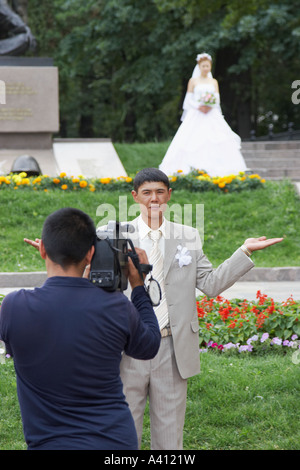 Bride And Groom Posing For Wedding Video Stock Photo