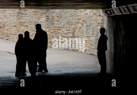 Teenagers boys hanging about in subway UK Stock Photo