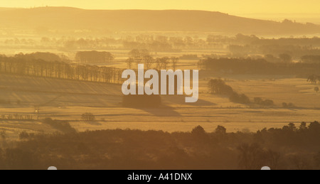 A misty frosty winter landscape at sunrise looking across the River Nith to Glencaple near Dumfries Scotland UK Stock Photo