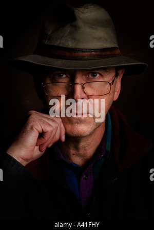 Portrait of a man in a well worn fedora.  Color version Stock Photo