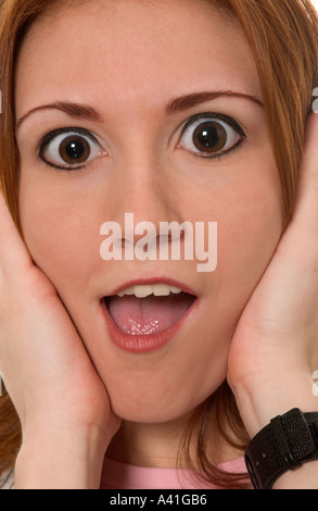 Stock Photo Showing Closeup of Caucasian Teen Girl With Hands on Face. USA Stock Photo