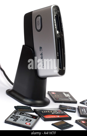 Sandisk Memory card reader with xD and Compact Flash cards scattered around it Stock Photo
