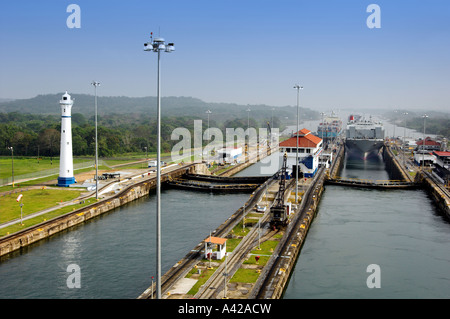 The Panama Canal lock system with ships entering a lower lock Panama, Central America Stock Photo