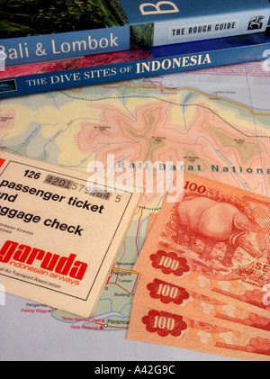 Bali guidebook Indonesia dive guide Garuda air ticket Indonesian rupiah currency map of Bali Stock Photo