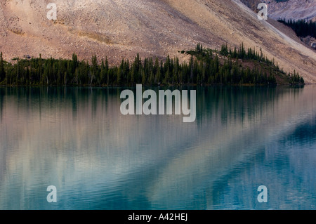 Crowfoot Mountain slopes reflected in Bow Lake., Banff National Park, Alberta, Canada Stock Photo