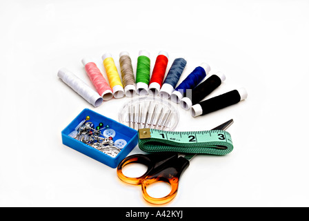 Sewing equipment, scissors, cotton, tape measure, buttons pins  on white background Stock Photo