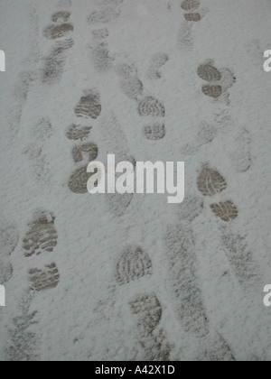 Traces in the snow. Winter background Stock Photo - Alamy