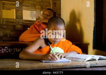 Novice Monks Study at the Wat Kang School Vang Vieng Laos Stock Photo