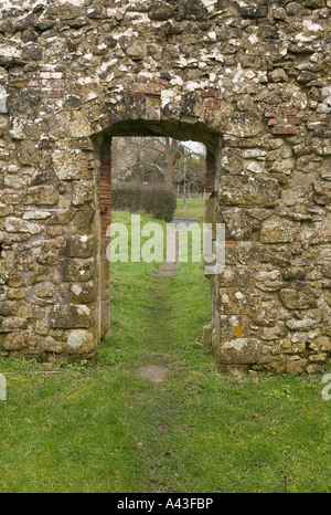 Doorway in an old stone wall of a derelict church Stock Photo