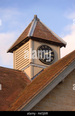 THE CLOCK TOWER OF A CONVERTED STABLE BLOCK UK Stock Photo