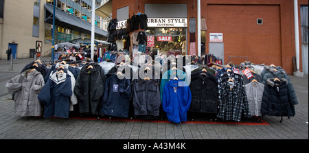 Birminghams famous Rag Market in the Bullring area of the city Jackets on sale on one of the stalls Stock Photo