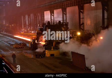 Steel slab being rolled on the Hot strip mill at Corus Llanwern steelworks Newport South Wales UK Stock Photo