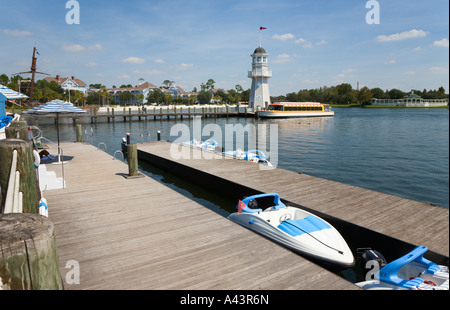 Shuttle boat loads passengers at lighthouse dock at Boardwalk in Walt Disney World, Florida, USA Stock Photo