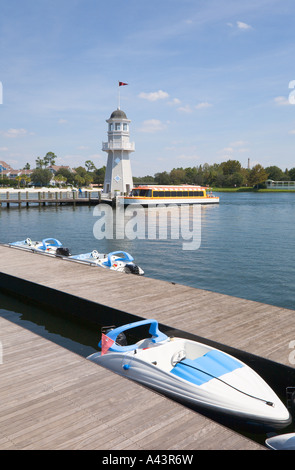 Shuttle boat loads passengers at lighthouse dock at Boardwalk in Walt Disney World, Florida, USA Stock Photo