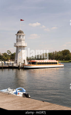 Shuttle boat loads passengers at lighthouse dock at Boardwalk in Walt Disney World, Florida, USA Stock Photo