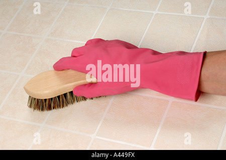 Scrubbing brush pink glove Stock Photo