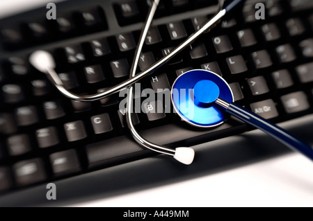 Stethoscope on computer keyboard Stock Photo