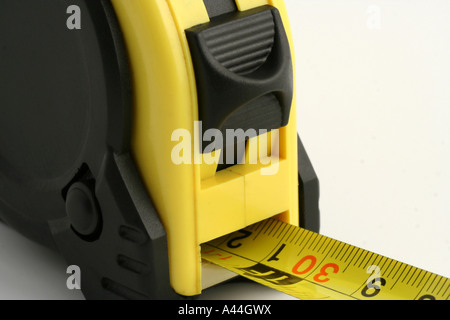 Self retracting pocket tape measure. Stock Photo