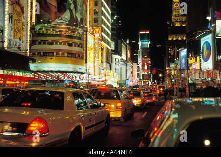 Taxi cabs on Broadway in Times Square at night Manhattan New York New York Stock Photo