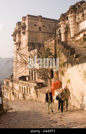 India Rajasthan Bundi Garh Palace western tourists walking up the steep path towards entrance Stock Photo