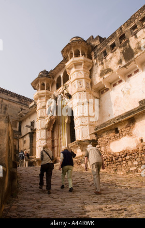 India Rajasthan Bundi Garh Palace western tourists walking up the steep path towards entrance gate Stock Photo