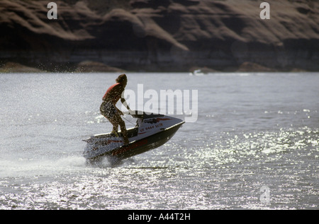 Young Man Jet Skiing On Lake Powell,Near Bull Frog In Utah. Stock Photo