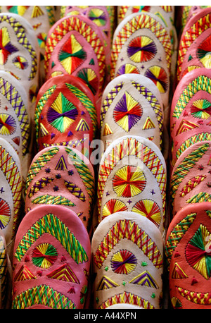 Colourful traditional Moroccan slippers babouches for sale in the souk markets Marrakesh Marrakech Morocco North Africa 2007 Stock Photo