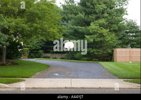 View of a house s driveway with a basketball hoop in the town of Moorestown NJ in New Jersey USA July 2005 Stock Photo