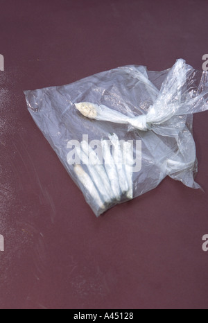 Marijuana cigarettes and crack cocaine rocks. Confiscated from suspected drug dealer. Kansas City, MO, Police. Stock Photo