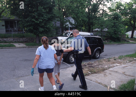 Police arresting female suspect Stock Photo - Alamy