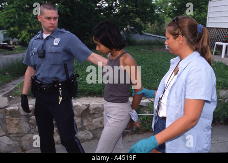 Police arresting female suspect Stock Photo