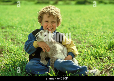 Little goat and child Stock Photo