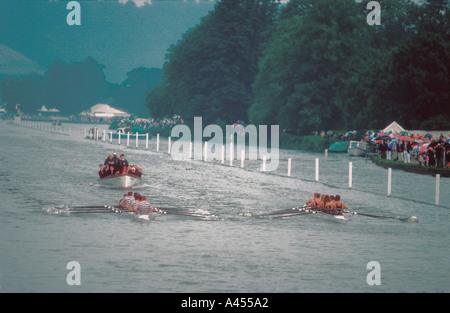 Rowing eights in the rain at Henley Royal Regatta on the River Thames in Oxfordshire England UK Stock Photo