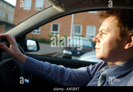Royalty free photograph of British driver commuting in London UK working hard all day and driving home at sunset Stock Photo