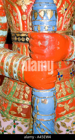 Brightly painted wooden sculpture of a Temple Guardian Thailand Stock Photo