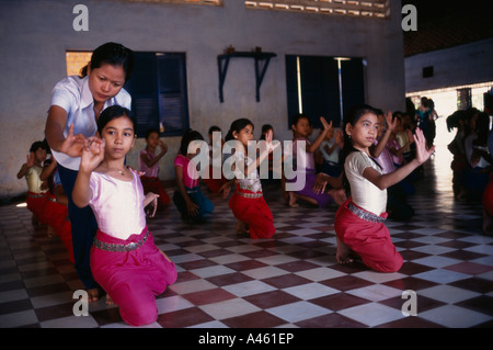 CAMBODIA Southeast Asia Phnom Penh Teacher with ballet students at the Royal University of Fine Arts Stock Photo