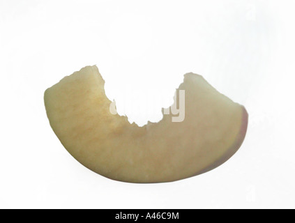 slice of apple fruit on white background with teeth or bite mark in flesh Concepts of healthy eating Stock Photo