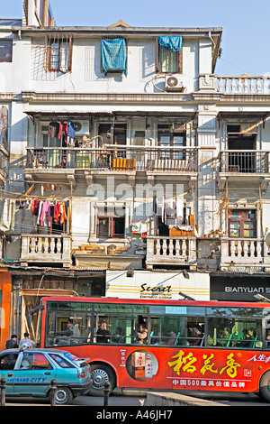 CHINA WUHAN Street scene in downtown Wuhan with crowded apartment balconies and clothes hanging in the sun Stock Photo