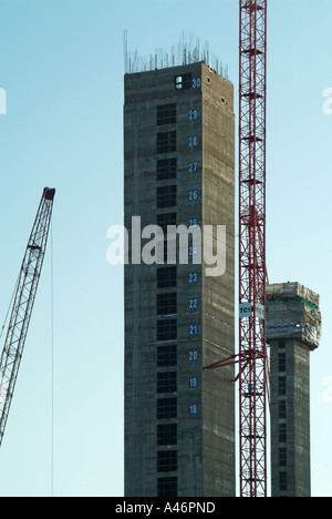 East end of London new tower block core being constructed with floor level marking on concrete wall Stock Photo