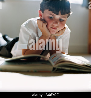 Boy reading on the floor