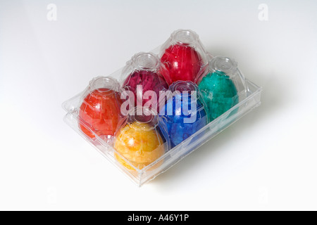 Colored eggs in clear box, easter eggs, cut-out Stock Photo