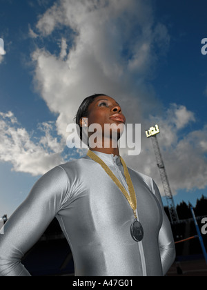 Female athlete wearing a medal Stock Photo