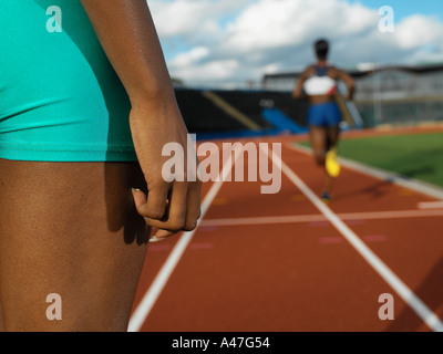 Female runners on race track Stock Photo